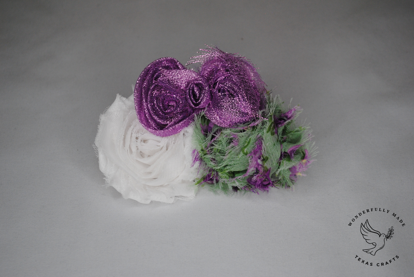 Purple and green flower clip