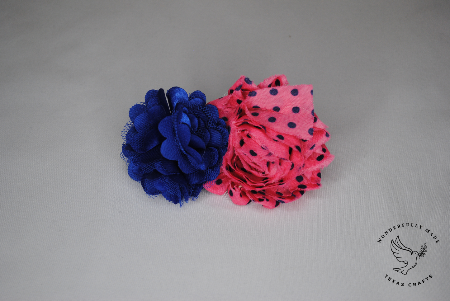 Navy and pink dot flower clip