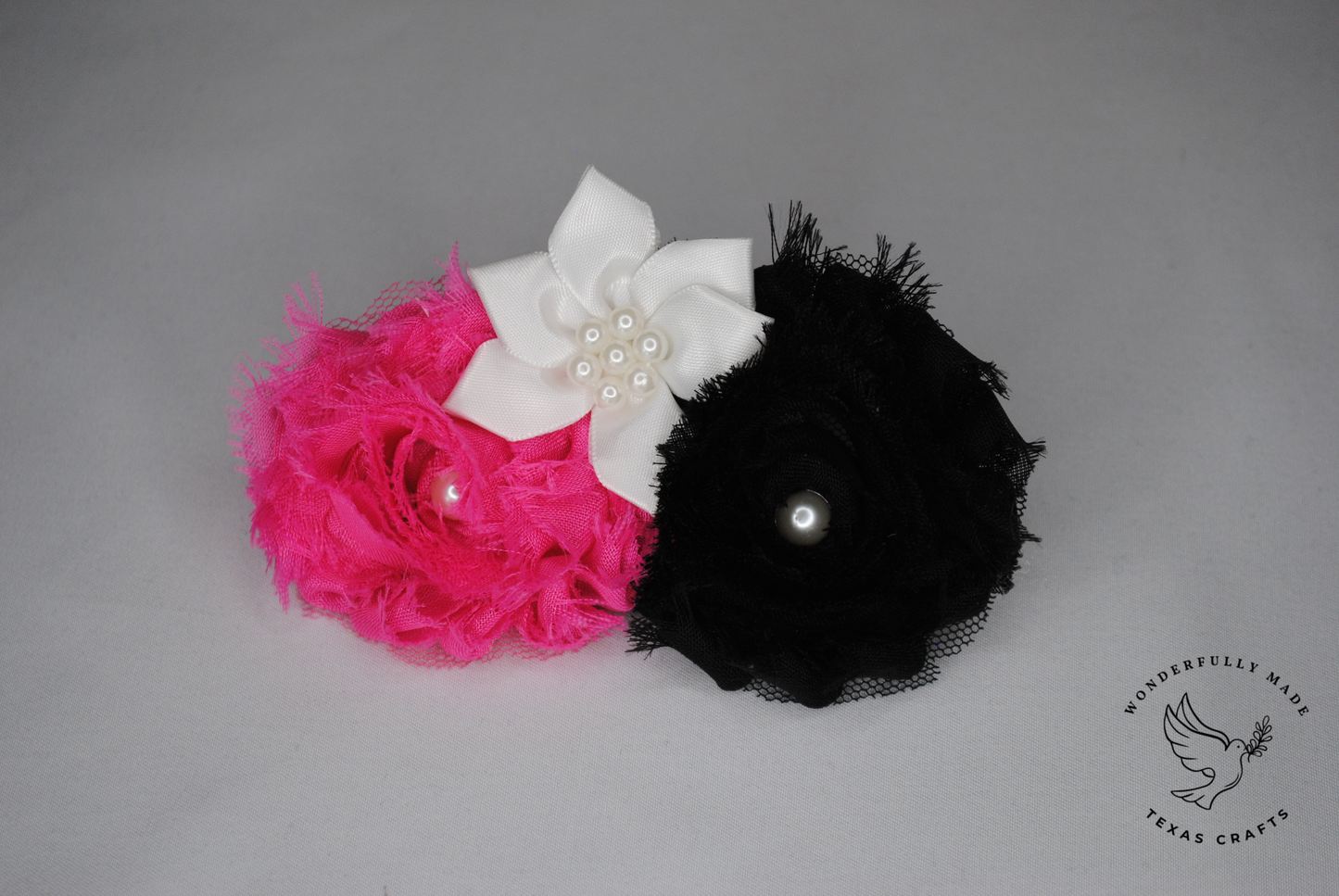 Black and pink flower clip