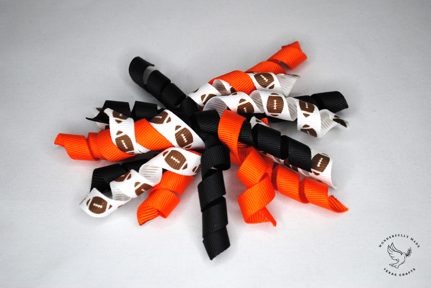 Orange, black and white with footballs